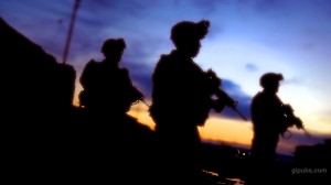 Purple Sunset Army Desktop Wallpaper of Soldiers on Patrol with a Magnificent Purple Sunset